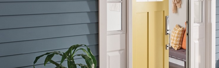 Schlage Custom Century Handleset on yellow front door.