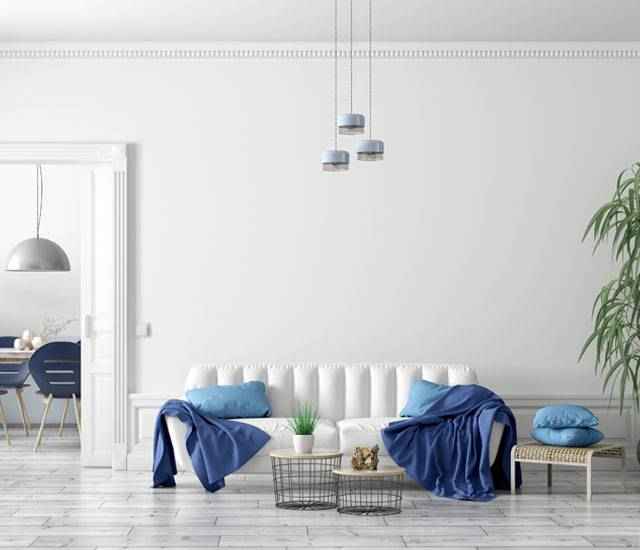 White living room with blue accents.