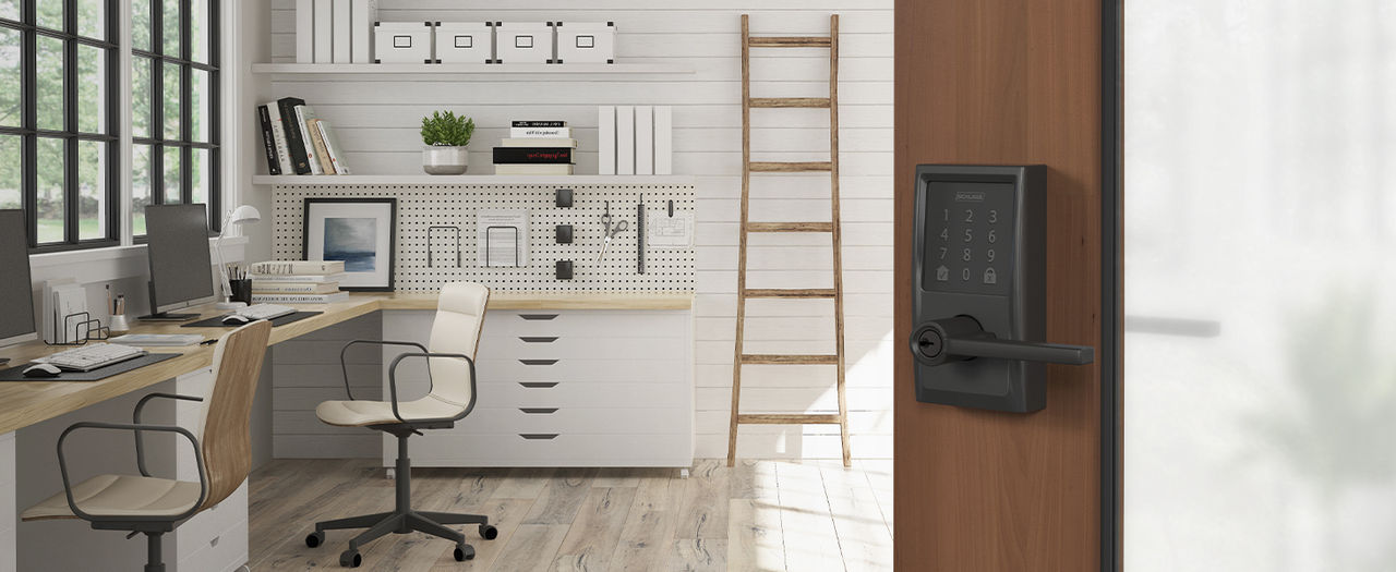 Matte Black Schlage Encode Smart Lever installed on open door revealing a home office scene